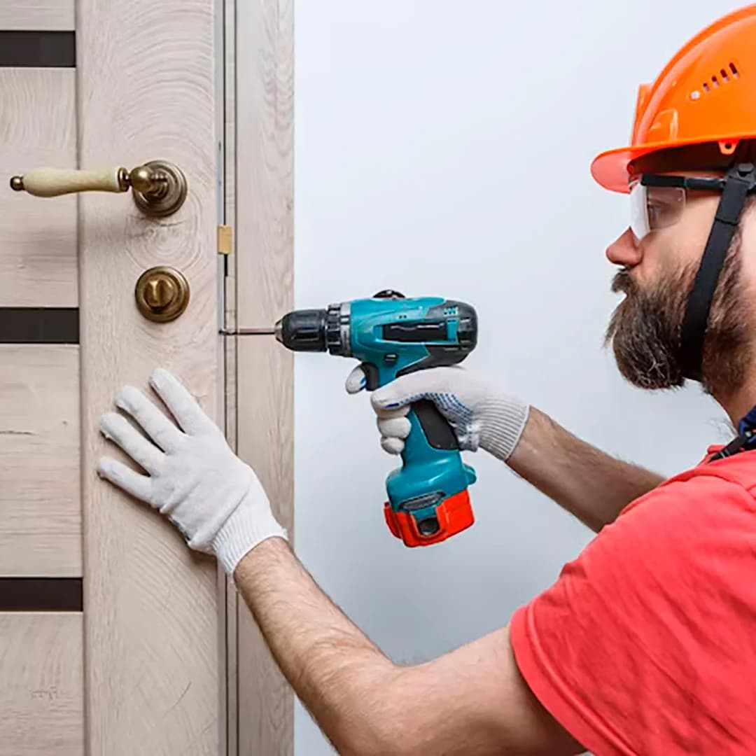 Emergency locksmith opening a euro cylinder on a City of London office door without drilling